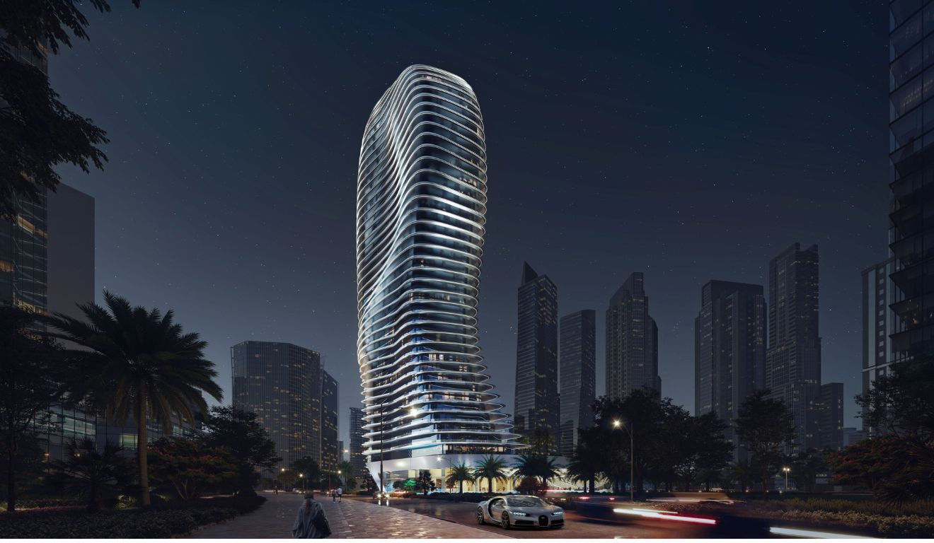 Fachada futurista e ondulada do edifício Bugatti Residences em Dubai iluminado à noite; Neymar é dono de uma das coberturas do edifício