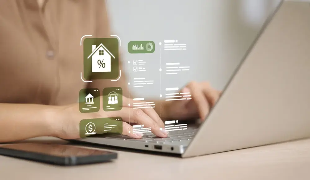 Mulher mexe em computador e infográfico mostrando símbolo de casa e de percentual aparece no centro da imagem, remetendo a operações de crédito, como financiamento imobiliário, e garantias, como hipoteca. Mulher mexe em computador e infográfico mostrando símbolo de casa e de percentual aparece no centro da imagem, remetendo a operações de crédito, como financiamento imobiliário, e garantias, como hipoteca.