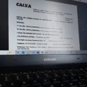 Tela de computador com edital de imóveis da Caixa aberto. Tela de computador com edital de imóveis da Caixa aberto.